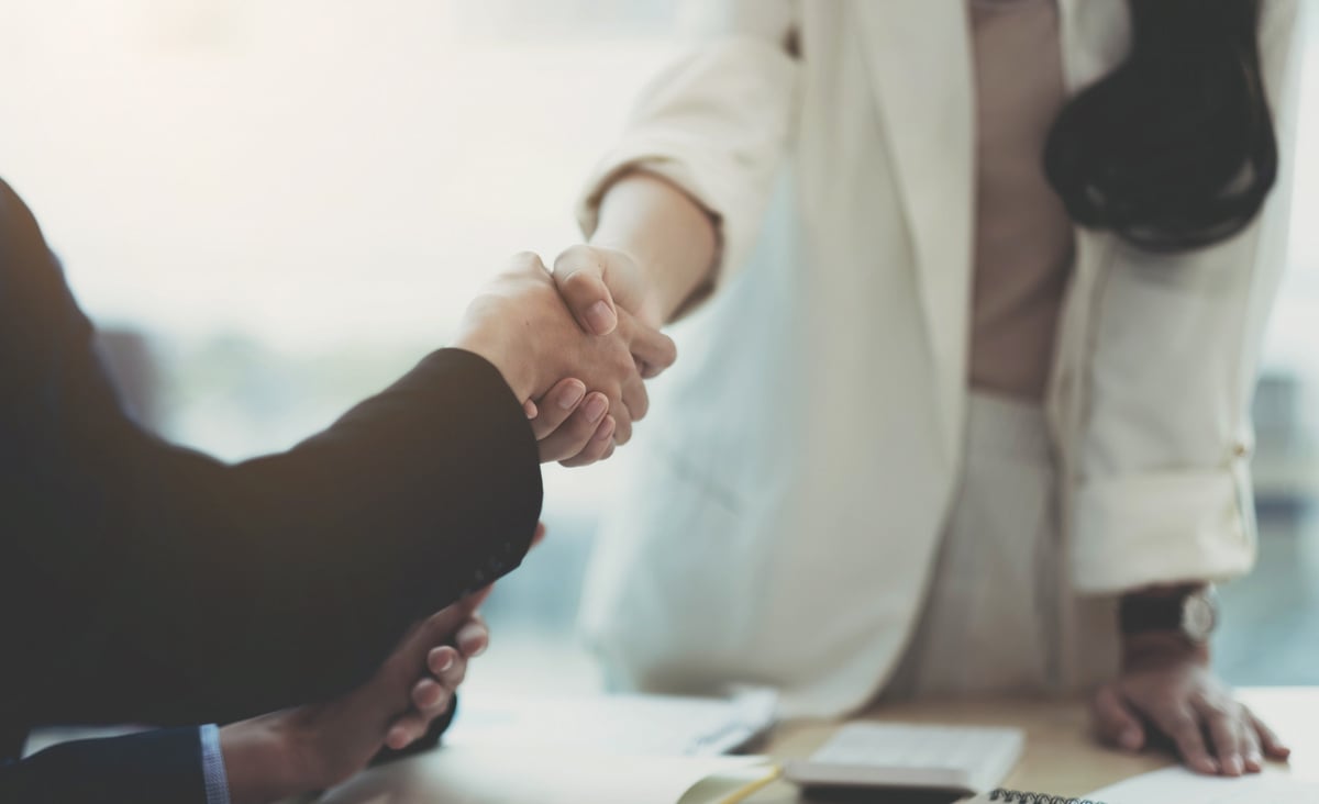 Close up of Business people shaking hands, finishing up meet